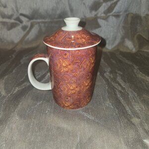 World Market Tea Infusing Mug with Red And Orange Floral Like Design